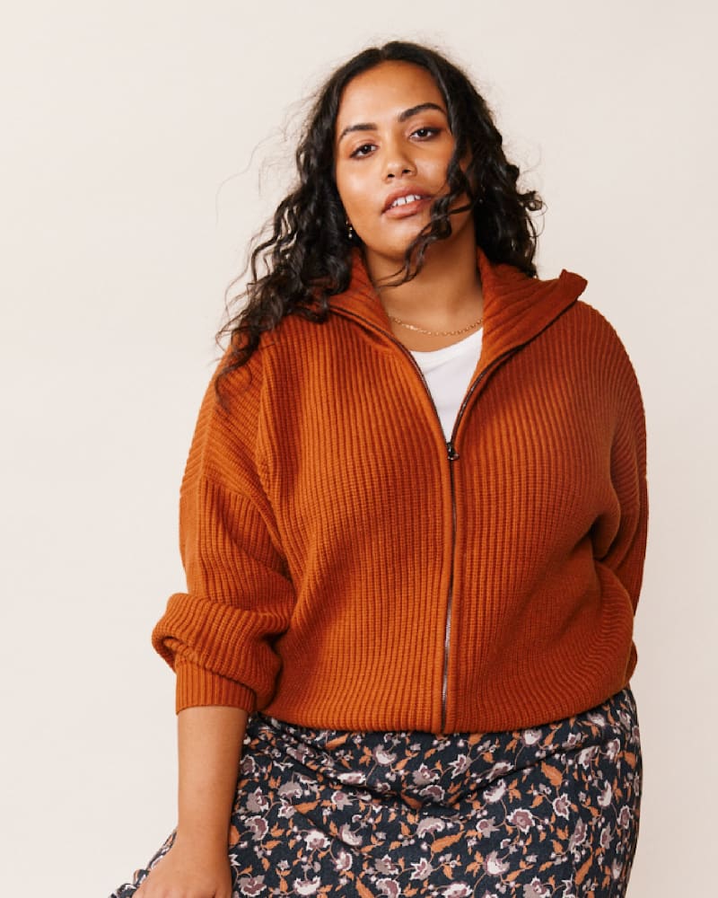 Front of a model wearing a size L Norma Zip Front Sweater in Gingerbread by ABLE. | dia_product_style_image_id:271436